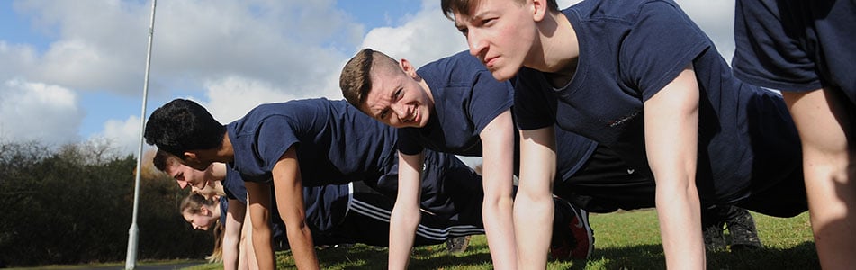 Students doing press ups